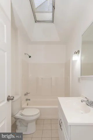 a bathroom with a sink and vanity