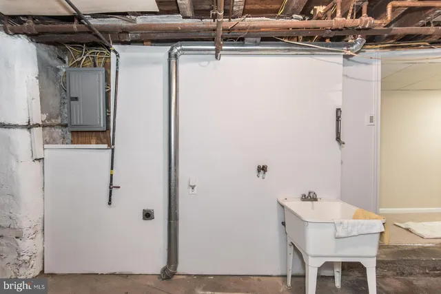 a white refrigerator freezer and a stove sitting inside of a kitchen