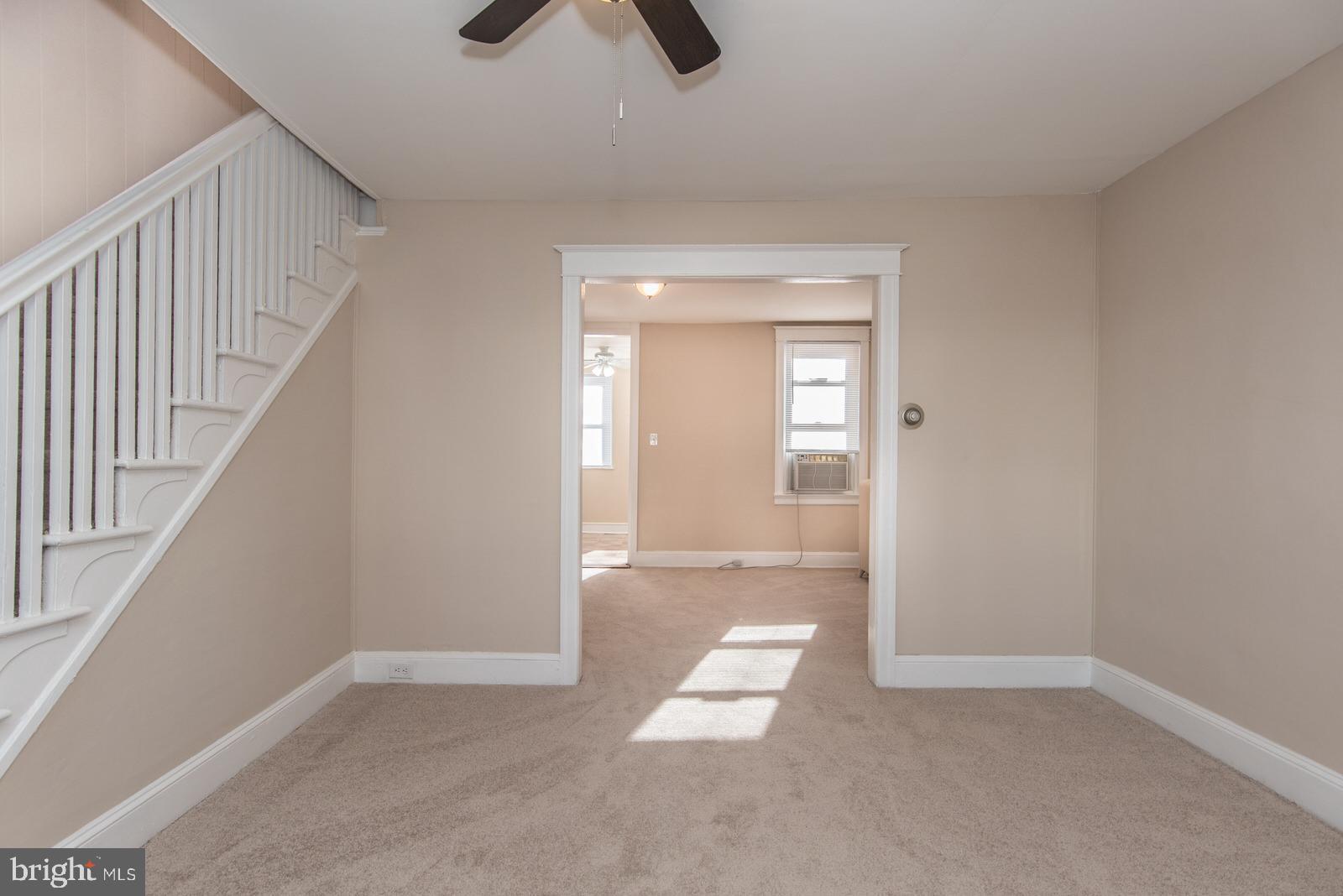 7119 Gillespie Street Philadelphia, PA 19135 - Photo 7 of 47 an empty room with wooden floor and windows
