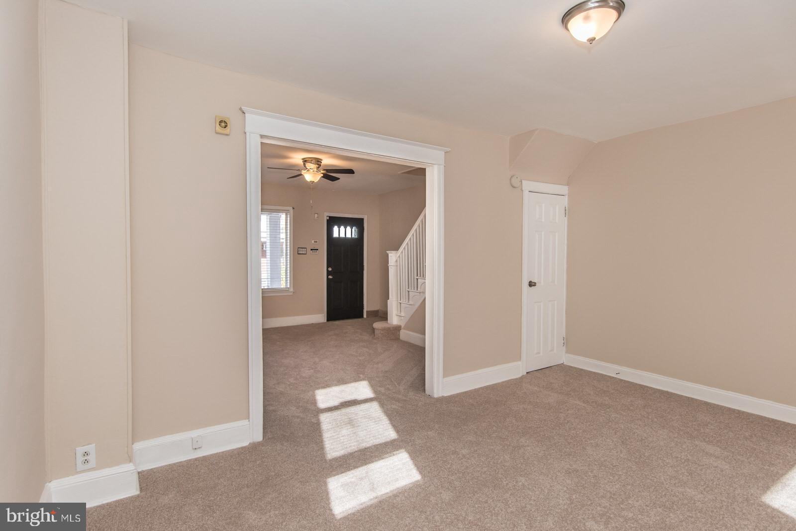 7119 Gillespie Street Philadelphia, PA 19135 - Photo 9 of 47 a view of an empty room with wooden floor and windows