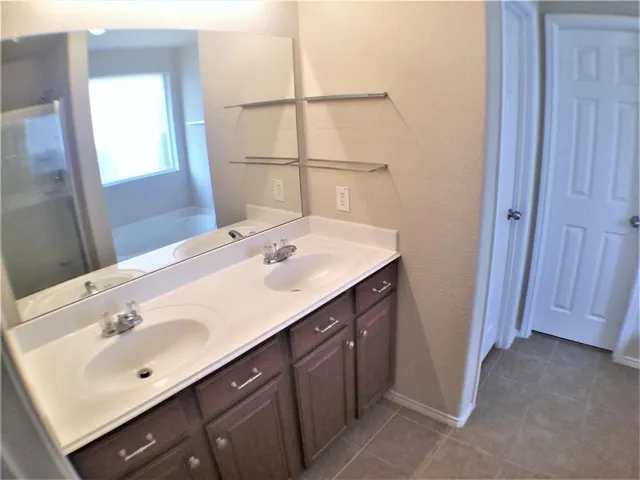 a white bath tub sitting next to a window
