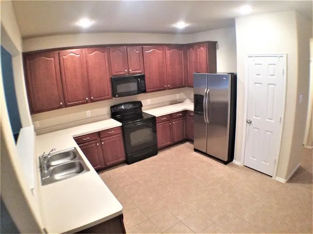 a bathroom with a double vanity sink and mirror