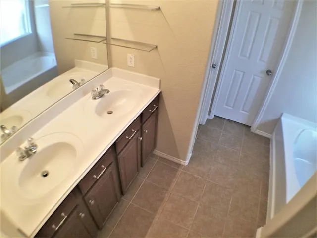 a bath tub sitting next to a window