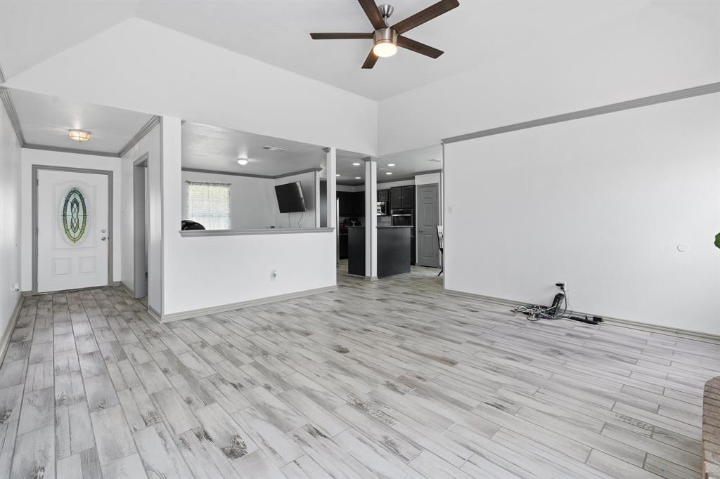 2600 Dave Angel Road Burleson, TX 76028 - Photo 11 of 33 a view of a livingroom with wooden floor and white walls
