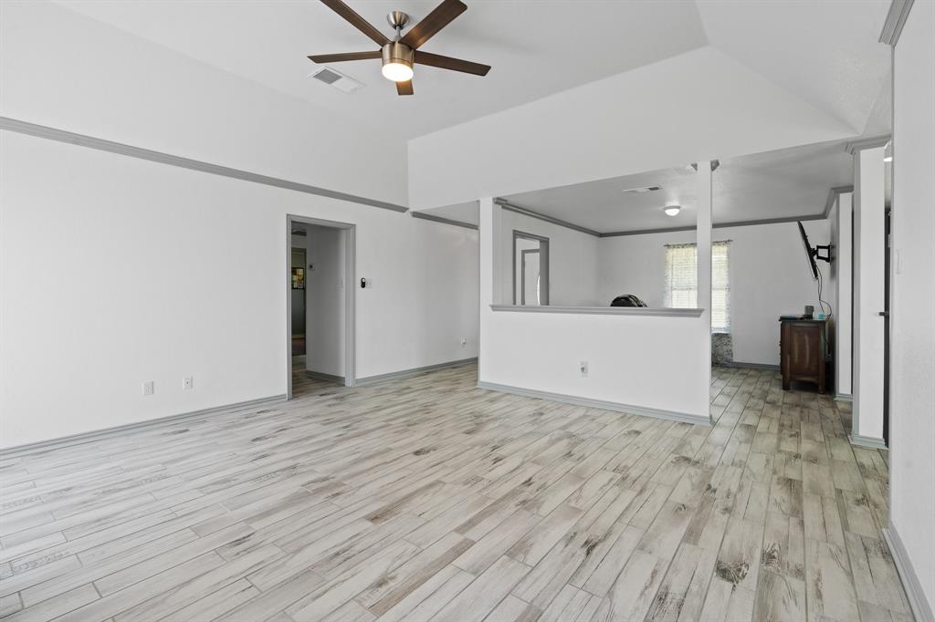 2600 Dave Angel Road Burleson, TX 76028 - Photo 12 of 33 a view of a room with wooden floor and white walls