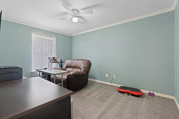 a living room with furniture and a table