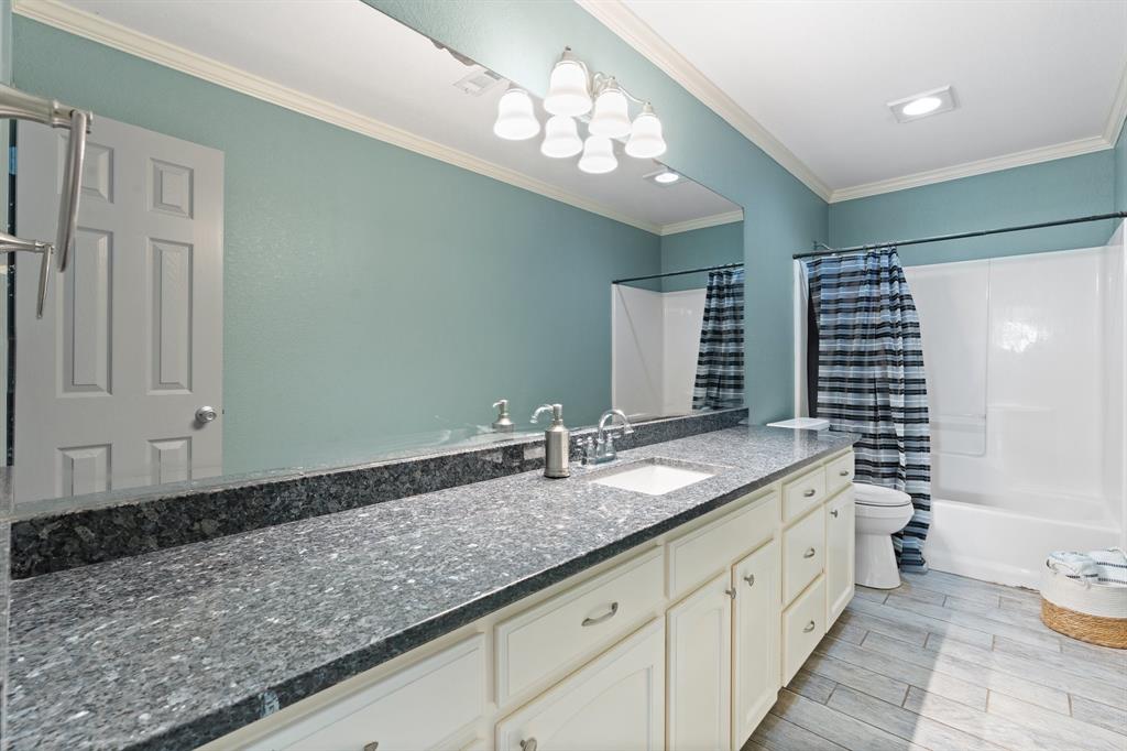 2600 Dave Angel Road Burleson, TX 76028 - Photo 29 of 31 a bathroom with a granite countertop sink and a mirror