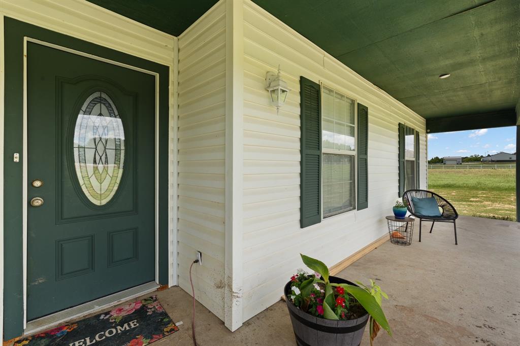 2600 Dave Angel Road Burleson, TX 76028 - Photo 7 of 31 a front view of a house with outdoor seating