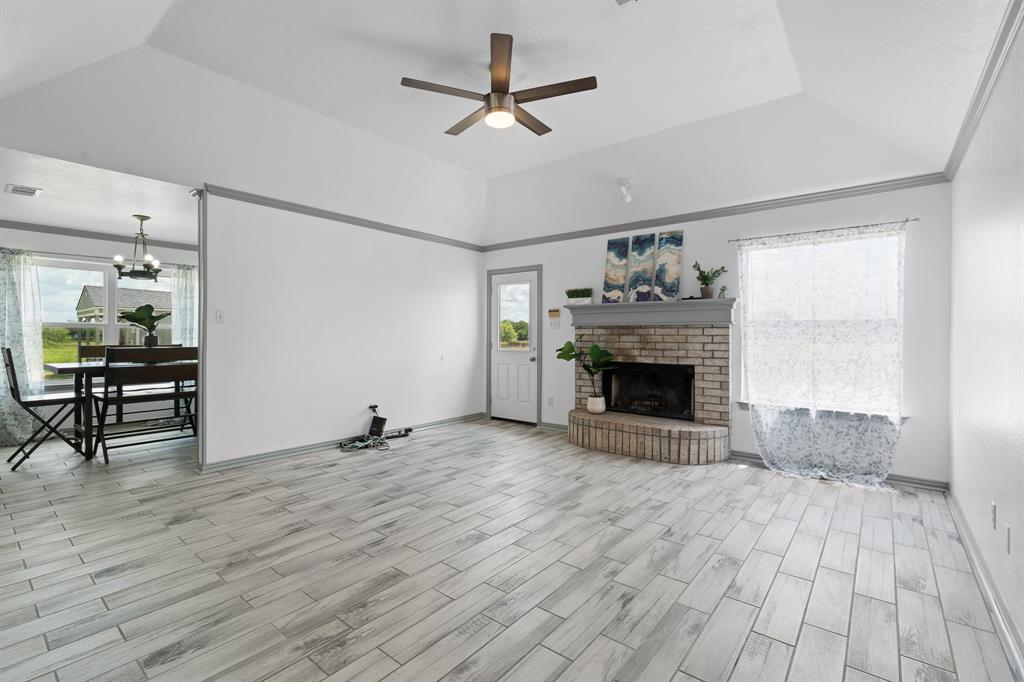 2600 Dave Angel Road Burleson, TX 76028 - Photo 9 of 33 a view of a livingroom with a fireplace and window