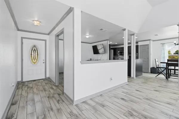 a view of a kitchen cabinets and wooden floor