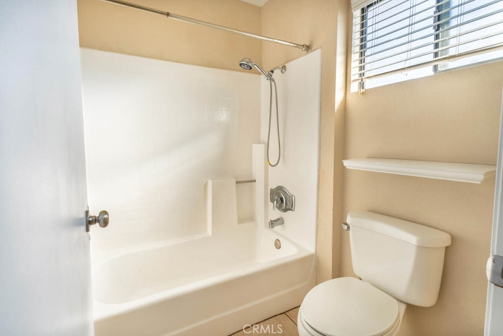 1217 Iris Court Lompoc, CA 93436 - Photo 19 of 29 a bathroom with a toilet and a shower