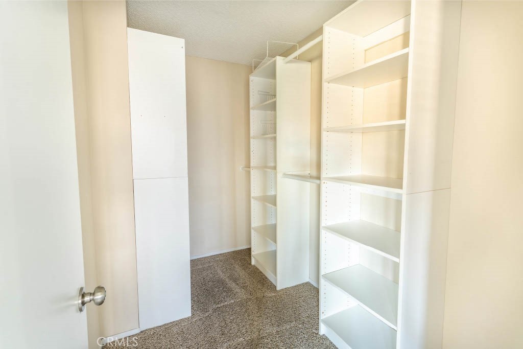 1217 Iris Court Lompoc, CA 93436 - Photo 22 of 29 a view of walk in closet with empty racks