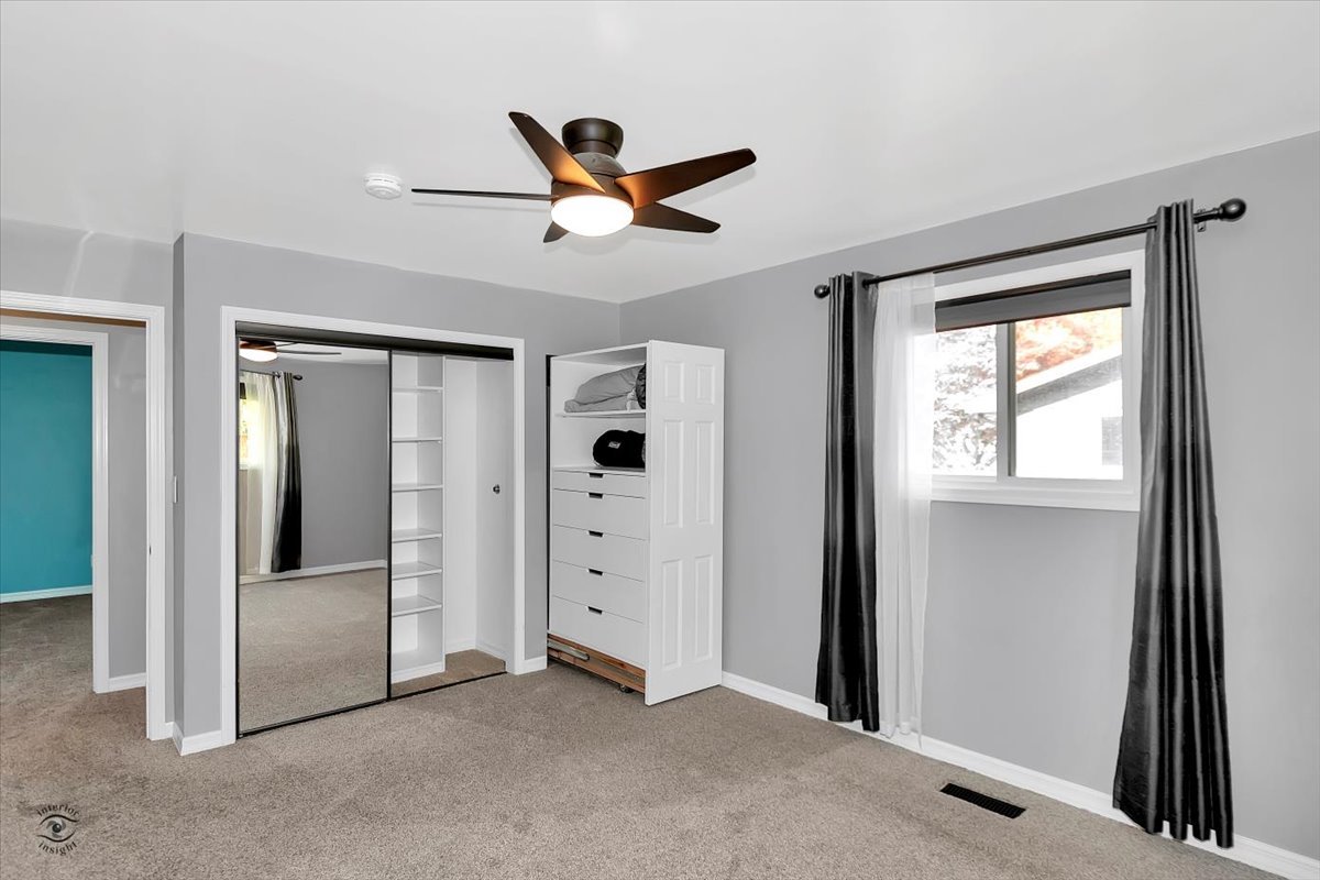 302 North Raven Road Shorewood, IL 60404 - Photo 11 of 26 a view of empty room with wooden floor