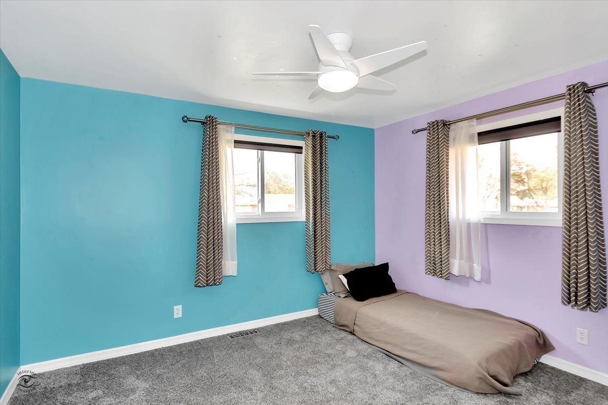 302 North Raven Road Shorewood, IL 60404 - Photo 14 of 26 a bedroom with a bed and window