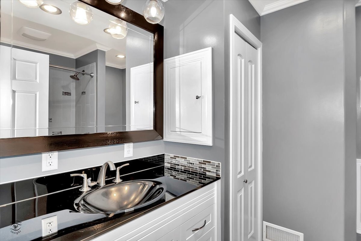 302 North Raven Road Shorewood, IL 60404 - Photo 16 of 26 a kitchen that has a sink and cabinets