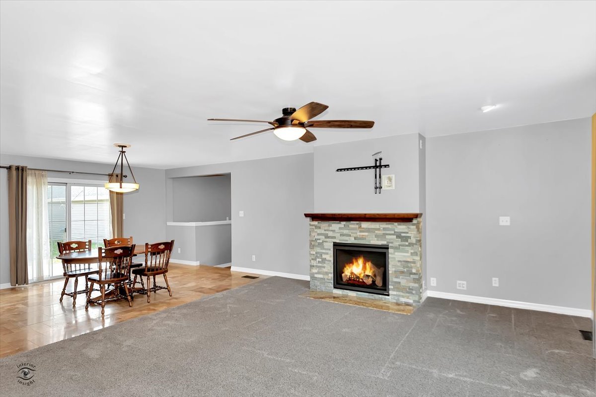 302 North Raven Road Shorewood, IL 60404 - Photo 3 of 26 a living room with furniture and a fireplace