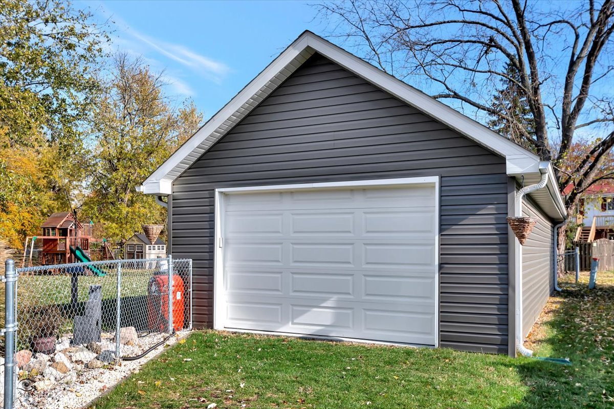 302 North Raven Road Shorewood, IL 60404 - Photo 23 of 26 a front view of a house with garden