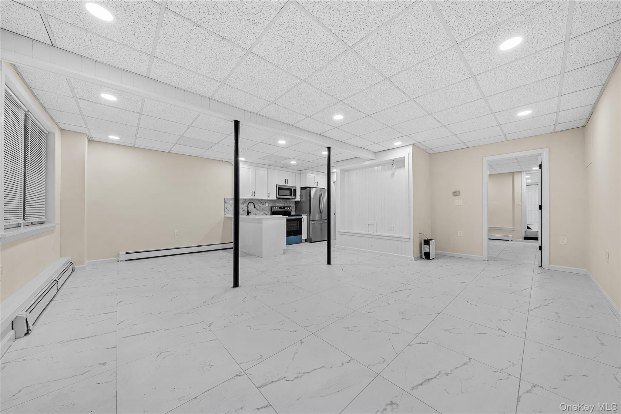 57 Eastwood Road Miller Place, NY 11764 - Photo 28 of 45 a view of an empty room with wooden floor