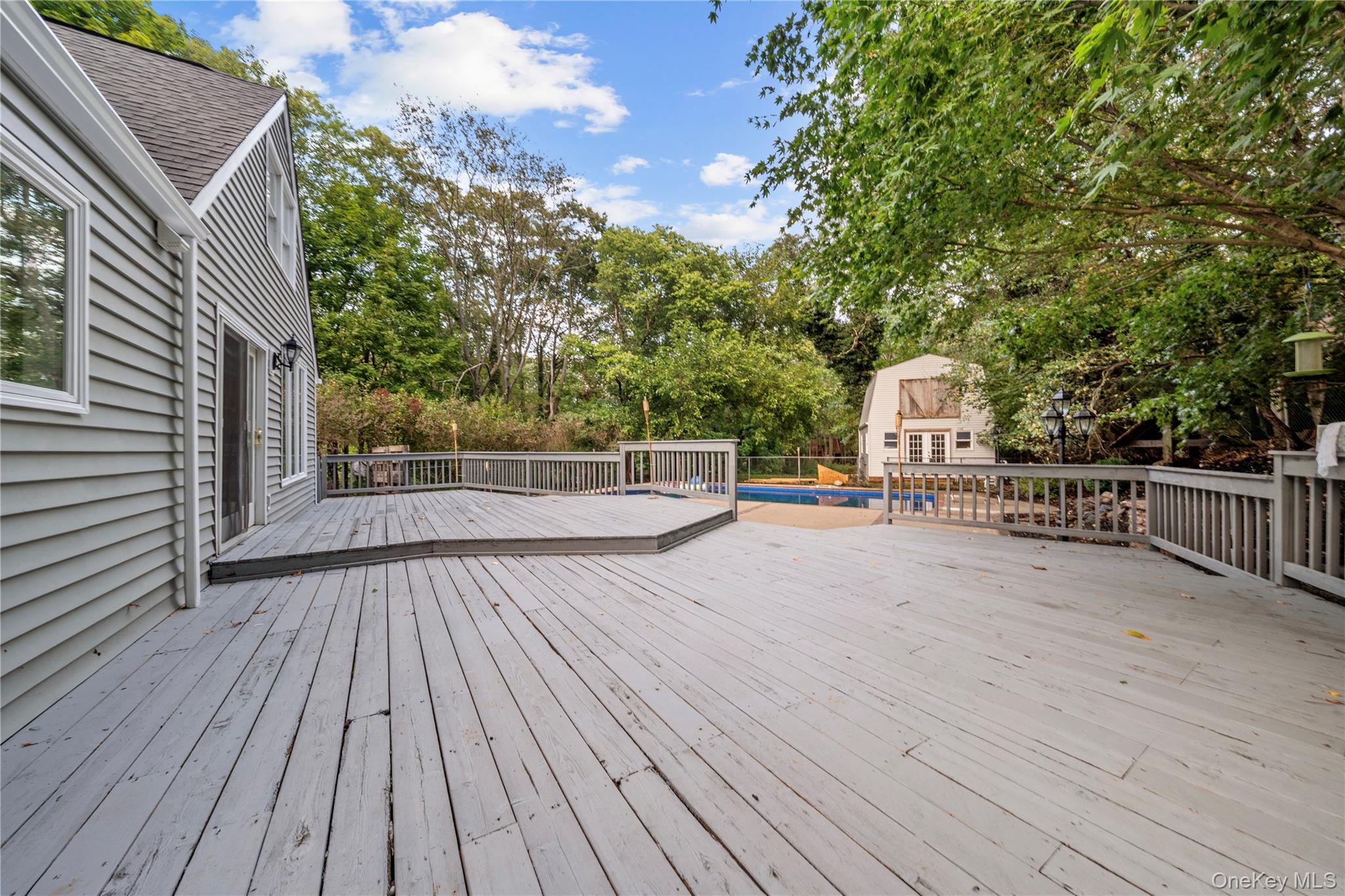 57 Eastwood Road Miller Place, NY 11764 - Photo 32 of 45 a view of terrace with wooden floor and fence