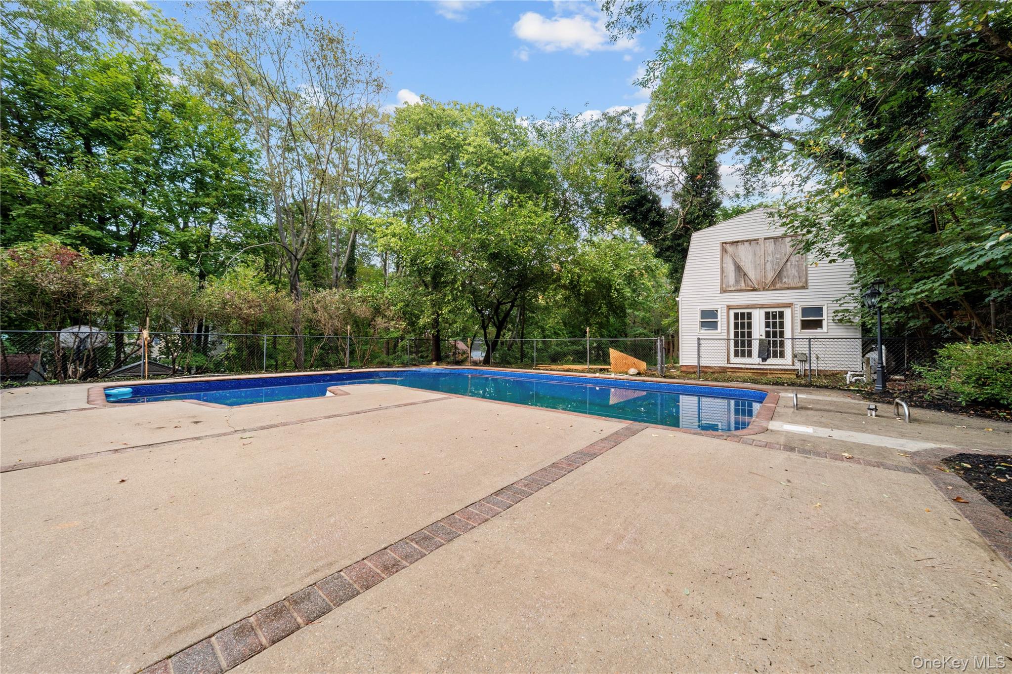 57 Eastwood Road Miller Place, NY 11764 - Photo 37 of 45 a view of the house and a yard