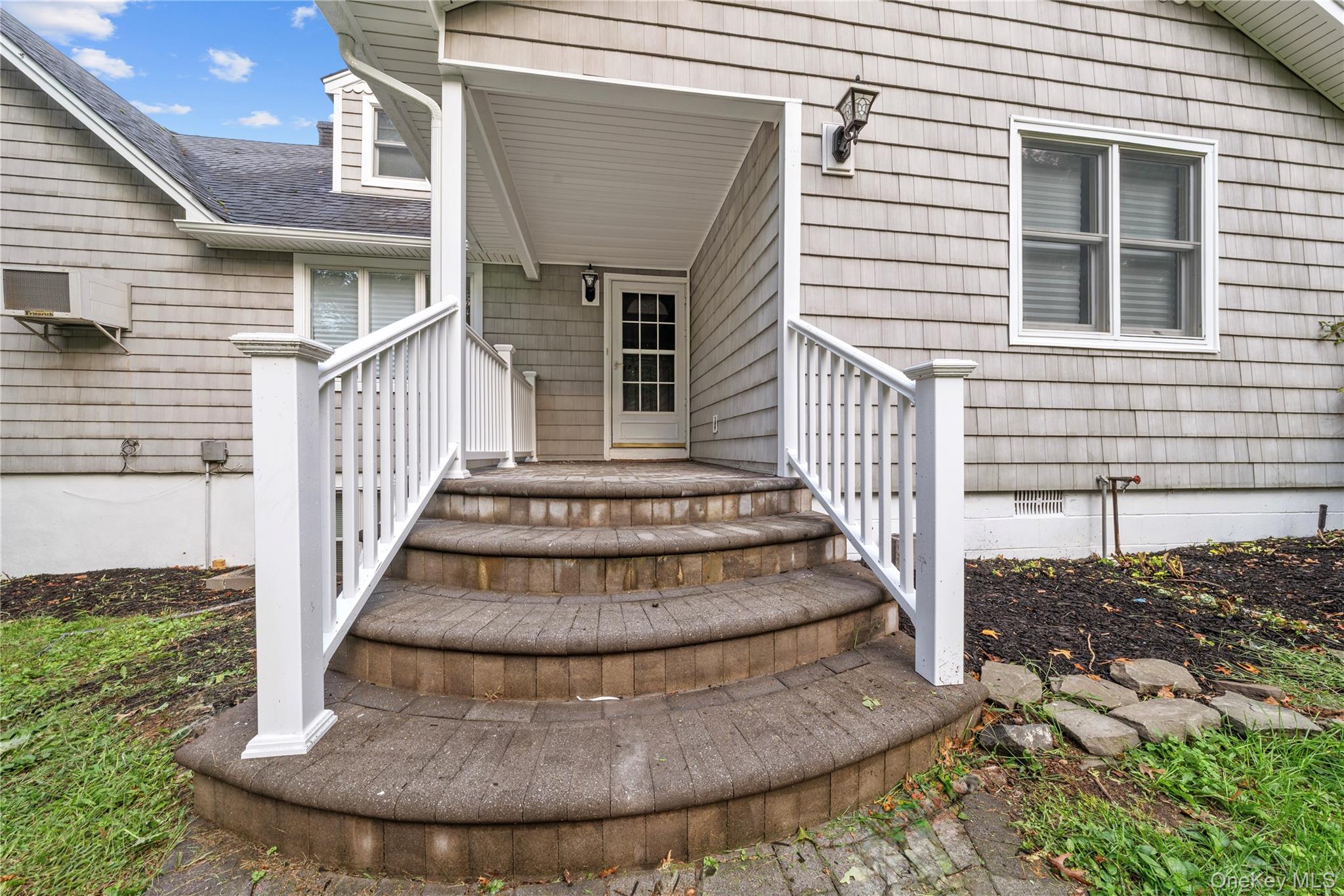 57 Eastwood Road Miller Place, NY 11764 - Photo 4 of 45 a view of entryway in front of house
