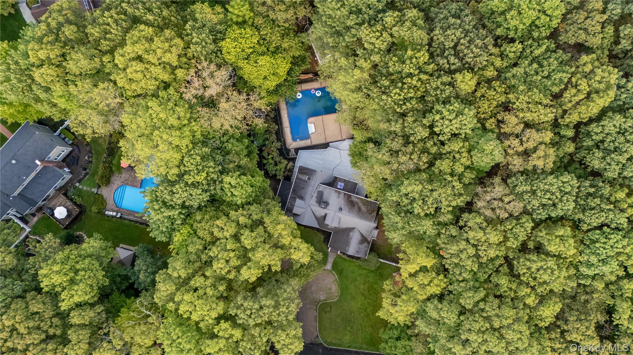 57 Eastwood Road Miller Place, NY 11764 - Photo 43 of 45 an aerial view of a house with a yard