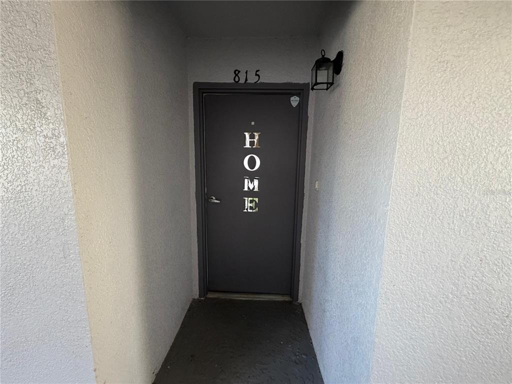 2323 McCoy Road, Unit 815 Orlando, FL 32809 - Photo 12 of 14 a view of a hallway