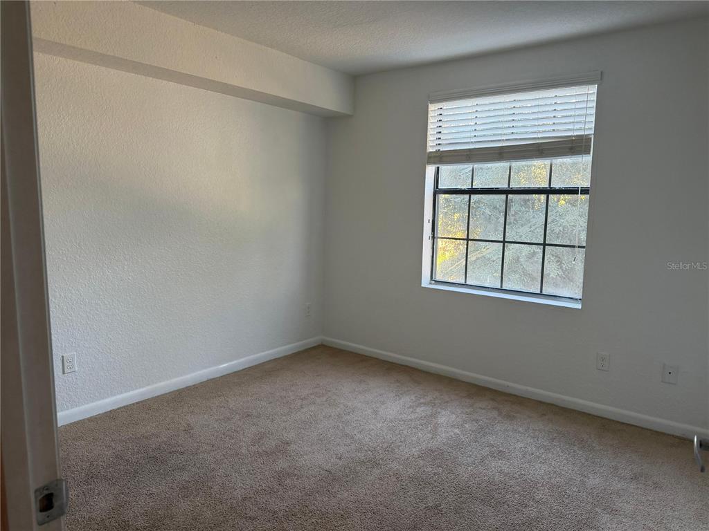 2323 McCoy Road, Unit 815 Orlando, FL 32809 - Photo 4 of 14 an empty room with a window