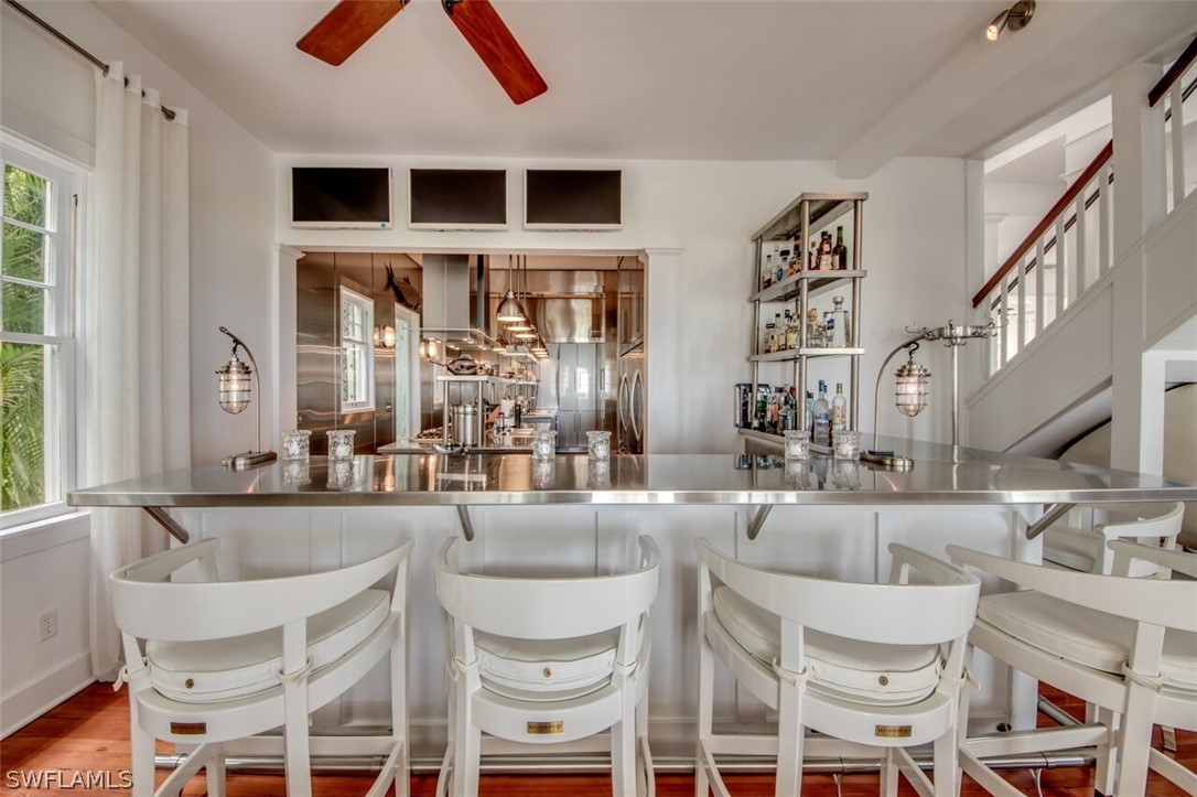 8241 Main Street Bokeelia, FL 33922 - Photo 13 of 35 a kitchen with a dining table and chairs