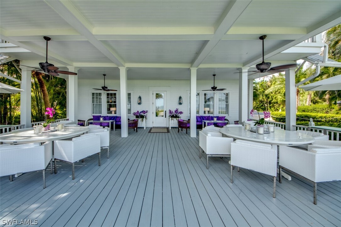 8241 Main Street Bokeelia, FL 33922 - Photo 22 of 35 a living room with furniture and a large window