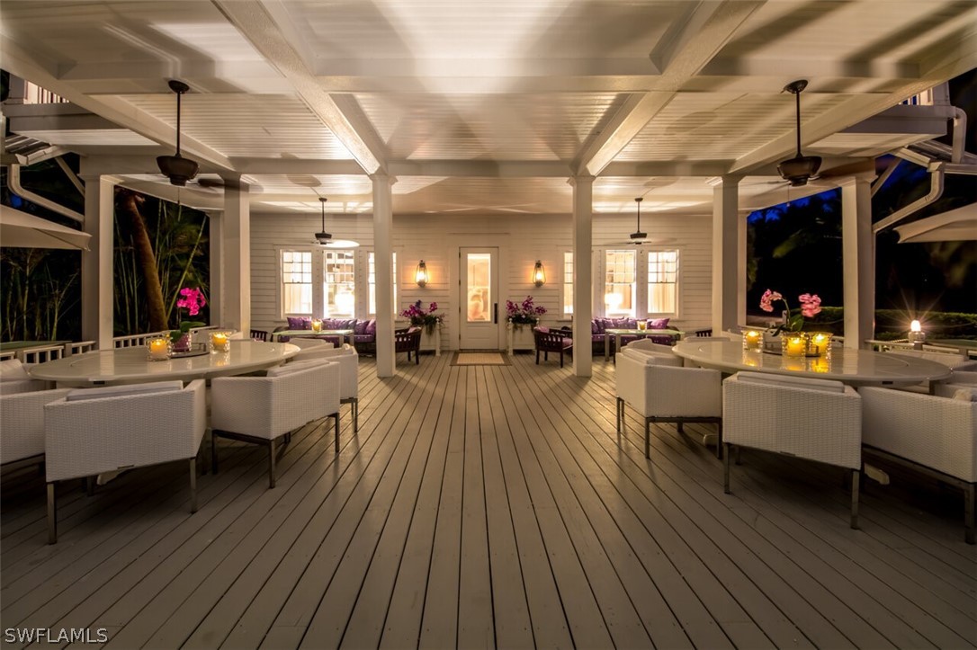 8241 Main Street Bokeelia, FL 33922 - Photo 23 of 35 a view of a swimming pool with outdoor seating