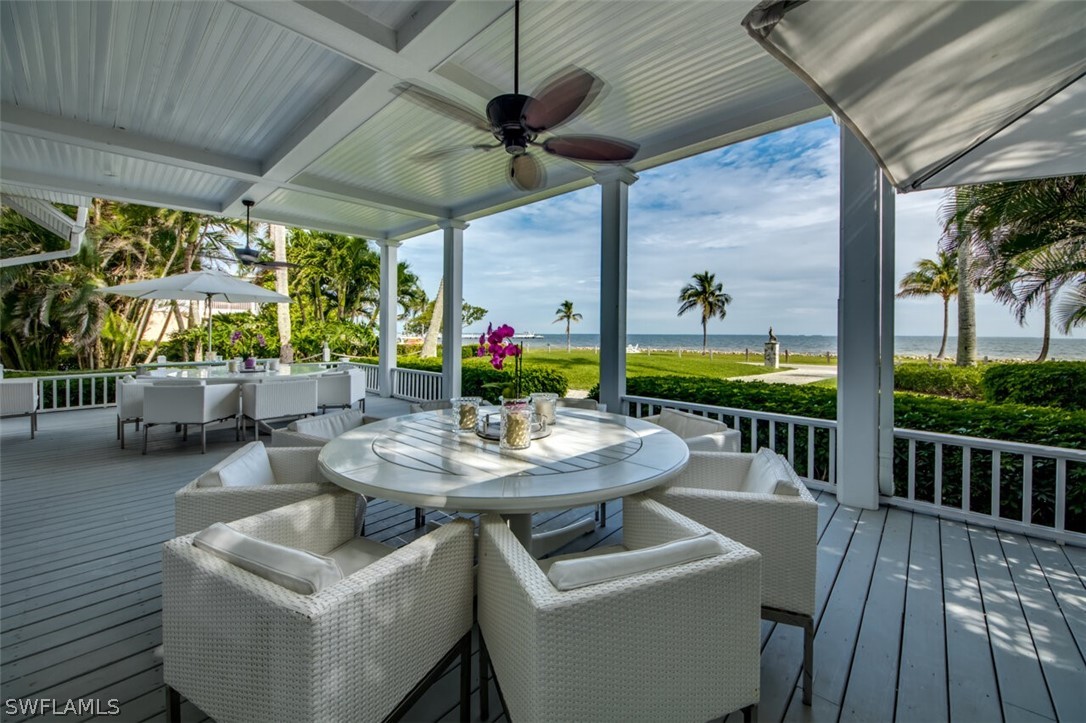 8241 Main Street Bokeelia, FL 33922 - Photo 25 of 35 a view of a patio with a table chairs and a patio