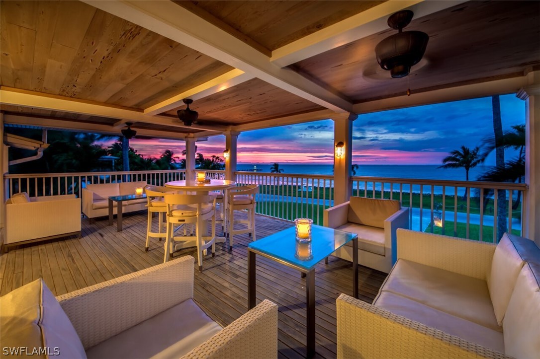 8241 Main Street Bokeelia, FL 33922 - Photo 28 of 35 a outdoor living space with patio furniture and a potted plant