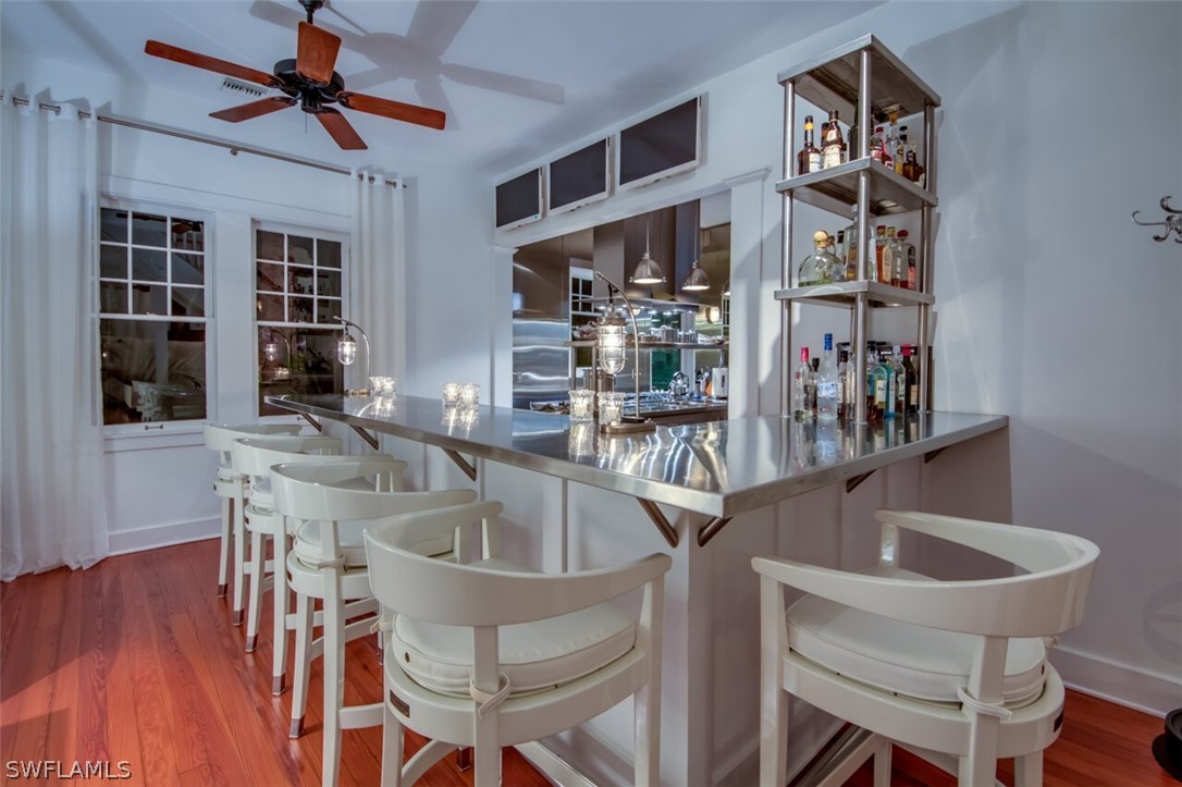 8241 Main Street Bokeelia, FL 33922 - Photo 29 of 35 a kitchen with a dining table and chairs