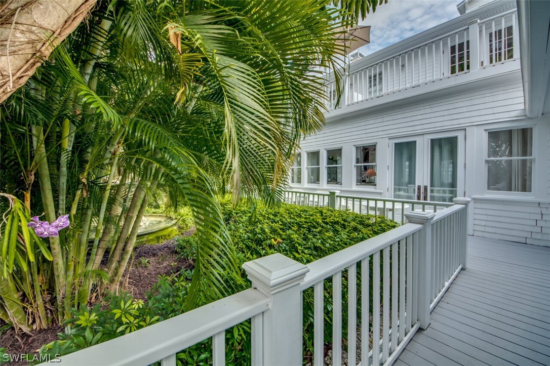 8241 Main Street Bokeelia, FL 33922 - Photo 32 of 35 a view of a house with wooden fence