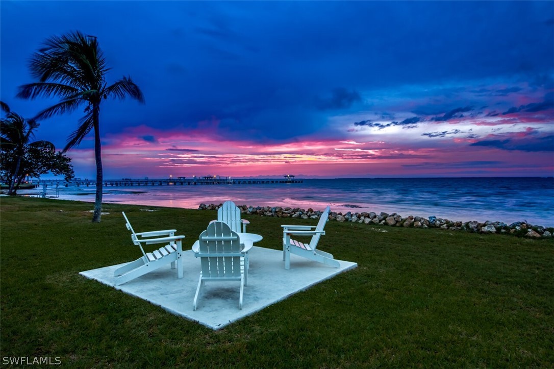 8241 Main Street Bokeelia, FL 33922 - Photo 33 of 35 a view of a golf course with a big yard