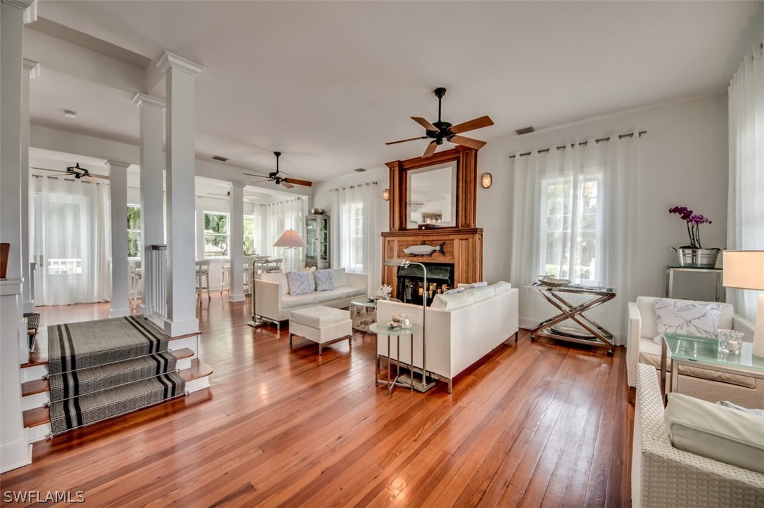 8241 Main Street Bokeelia, FL 33922 - Photo 6 of 35 a living room with furniture and a fireplace