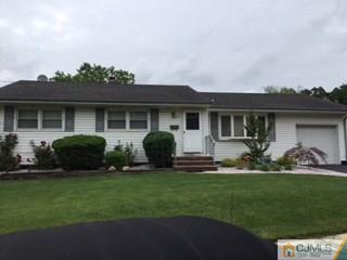 39 Montview Road Edison, NJ 08837 - Photo 1 of 5 a front view of house with yard and green space