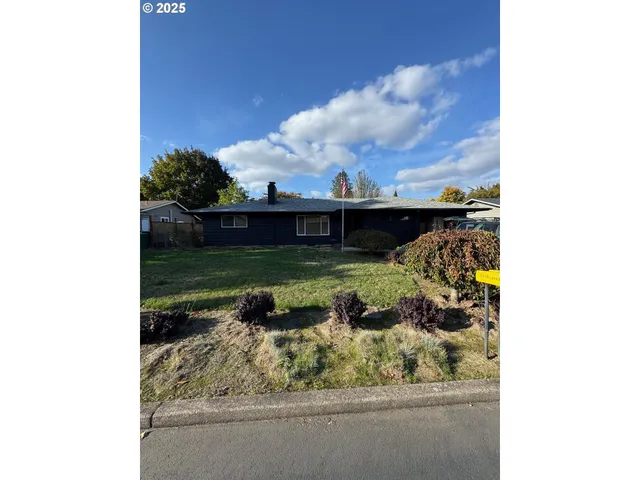 a view of a lake in a backyard