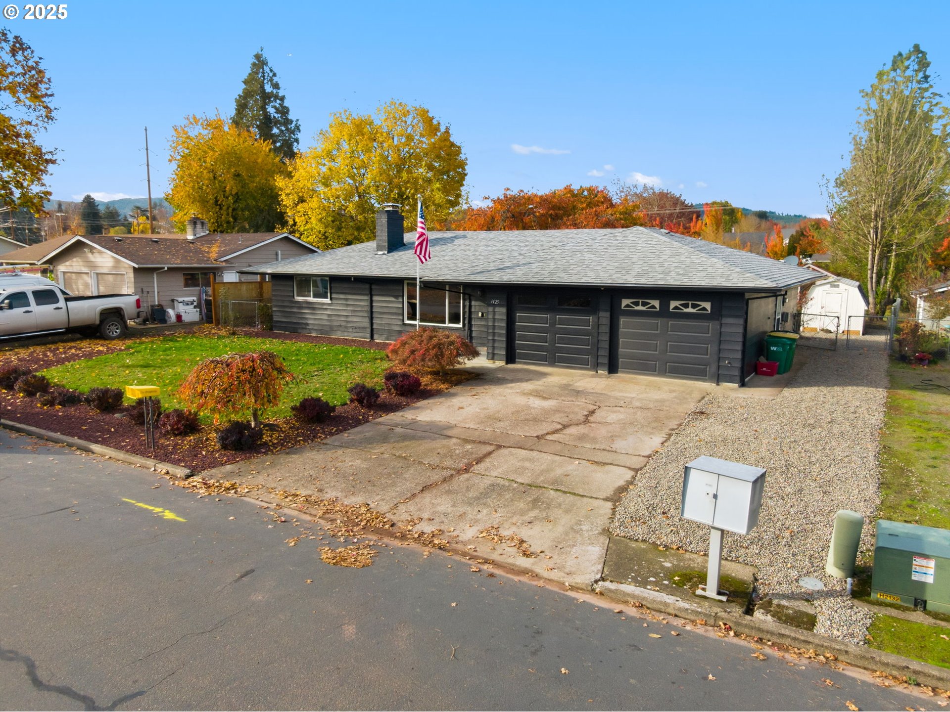 1425 Willamina Avenue Forest Grove, OR 97116 - Photo 26 of 38 a front view of a house with a yard and garage