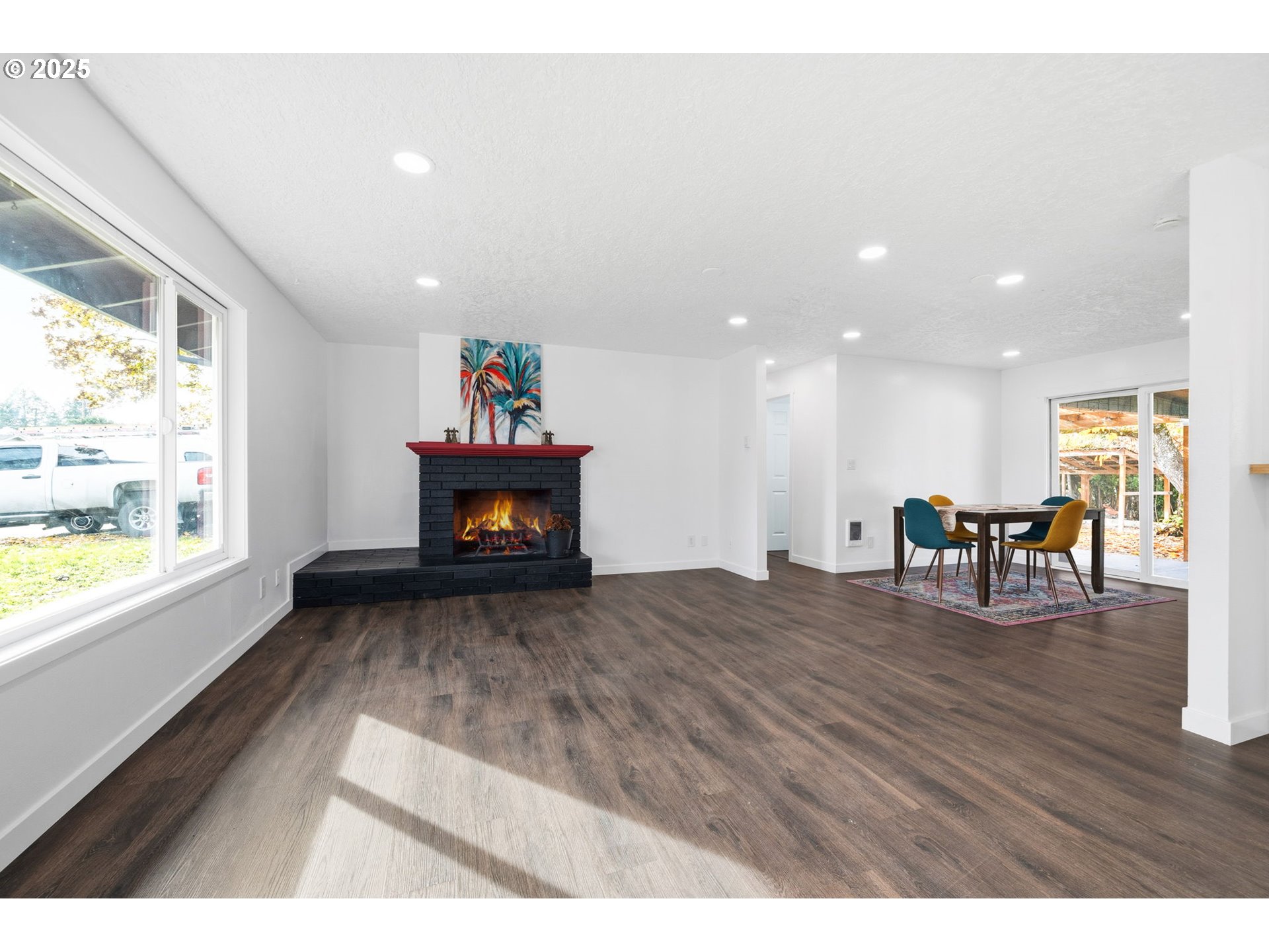 1425 Willamina Avenue Forest Grove, OR 97116 - Photo 35 of 38 a living room with furniture wooden floor and a fireplace