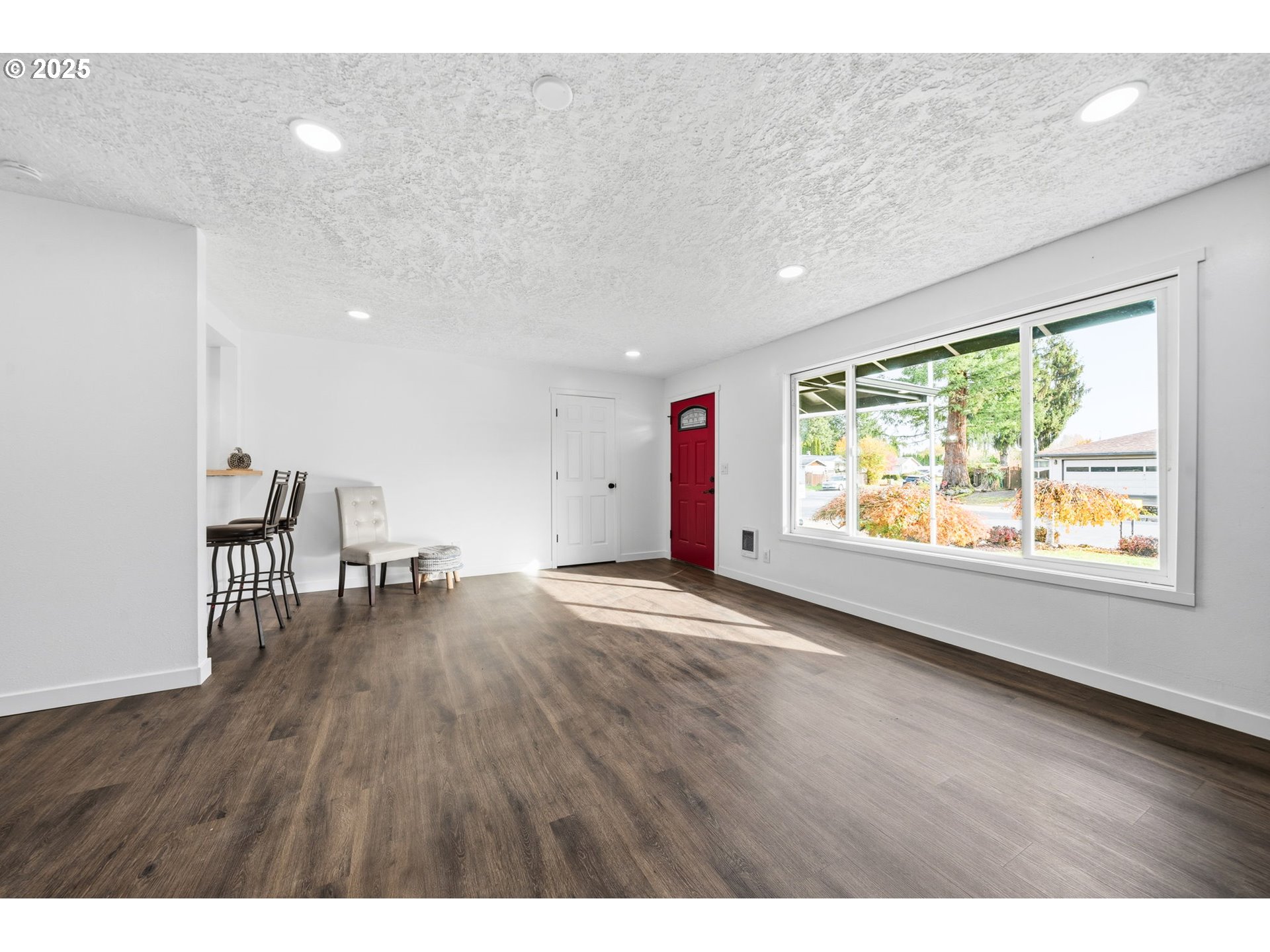 1425 Willamina Avenue Forest Grove, OR 97116 - Photo 38 of 38 a view of an empty room with wooden floor and a window
