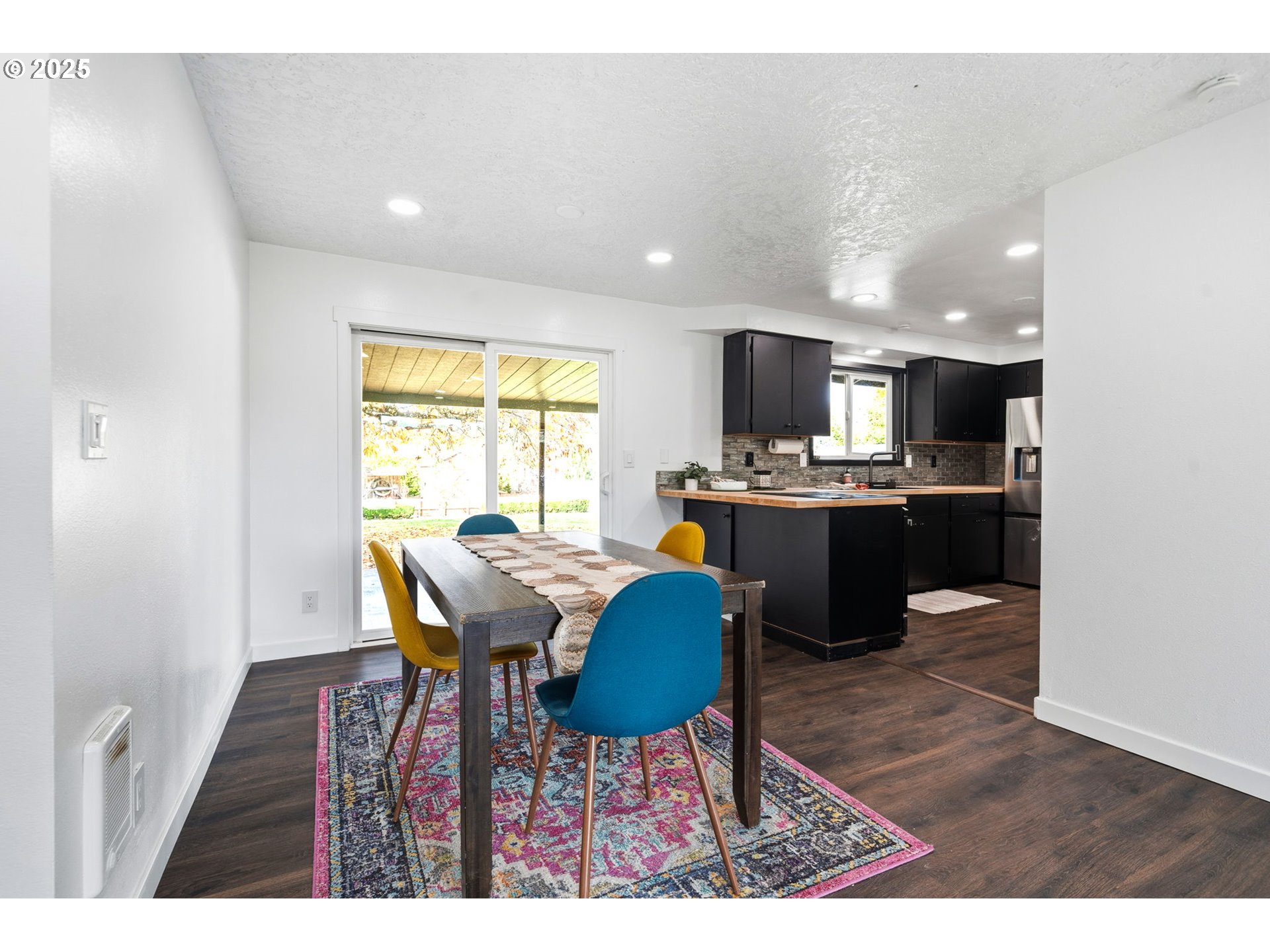 1425 Willamina Avenue Forest Grove, OR 97116 - Photo 4 of 38 a view of a dining room with furniture and a window