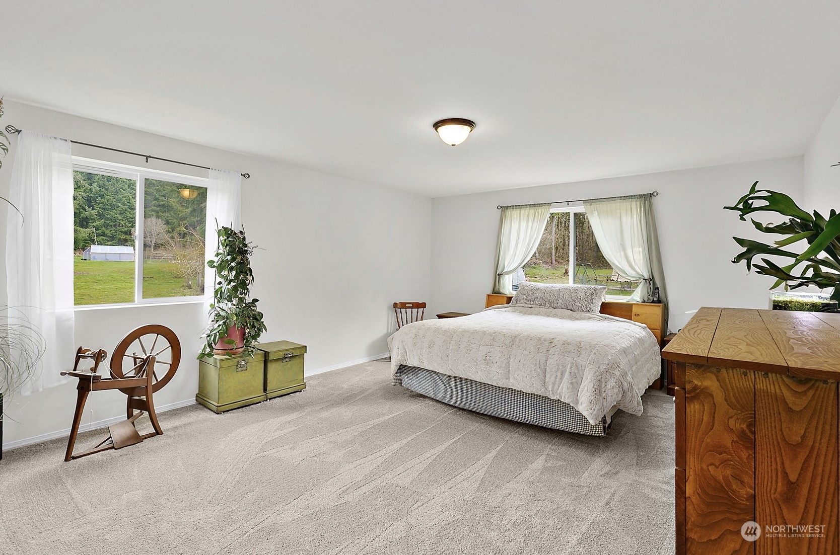 4923 163rd Lane Southwest Rochester, WA 98579 - Photo 9 of 40 a bedroom with a bed a table and a window