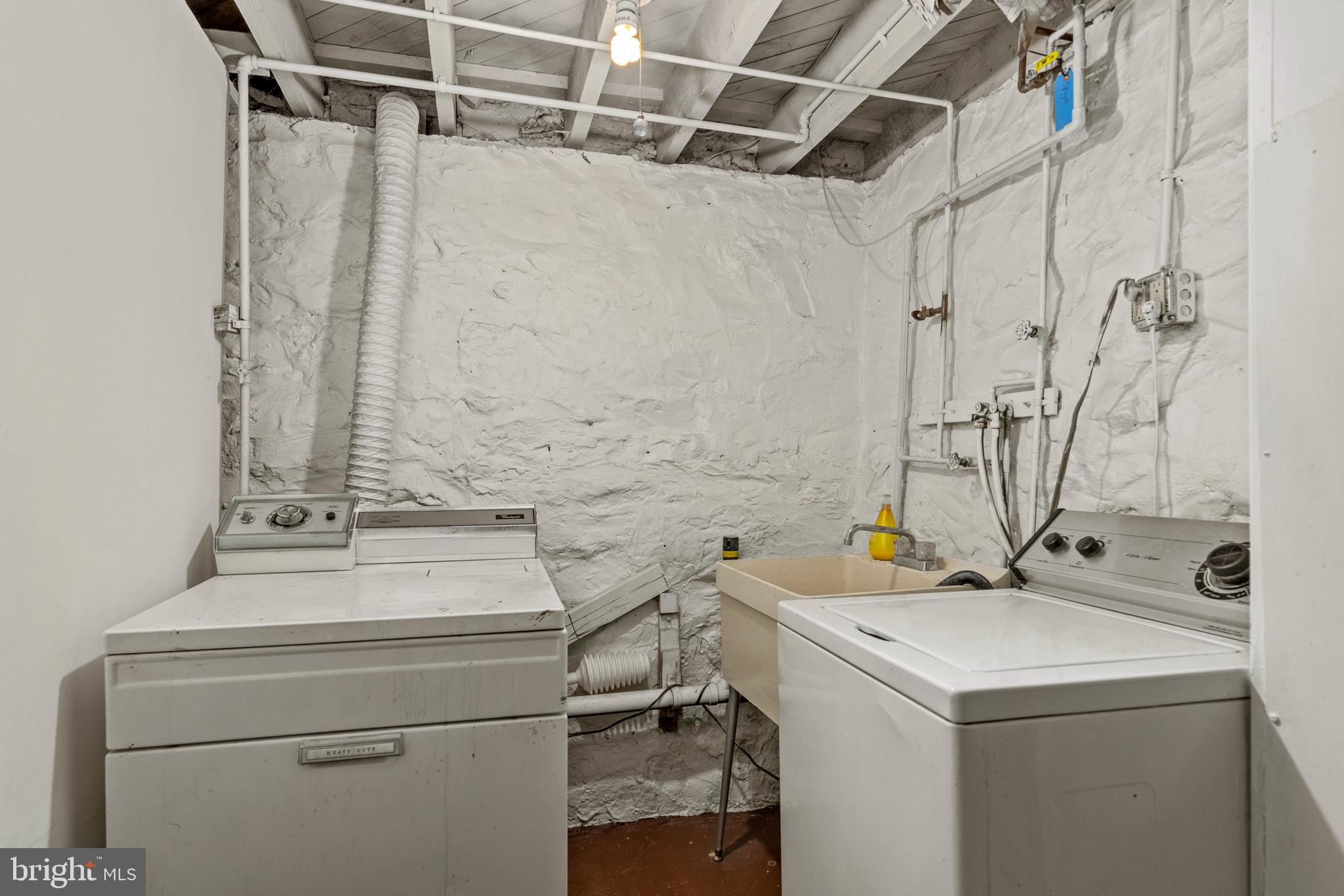 5708 Rockspring Road, Unit B Baltimore, MD 21209 - Photo 12 of 19 a utility room with dryer and washer