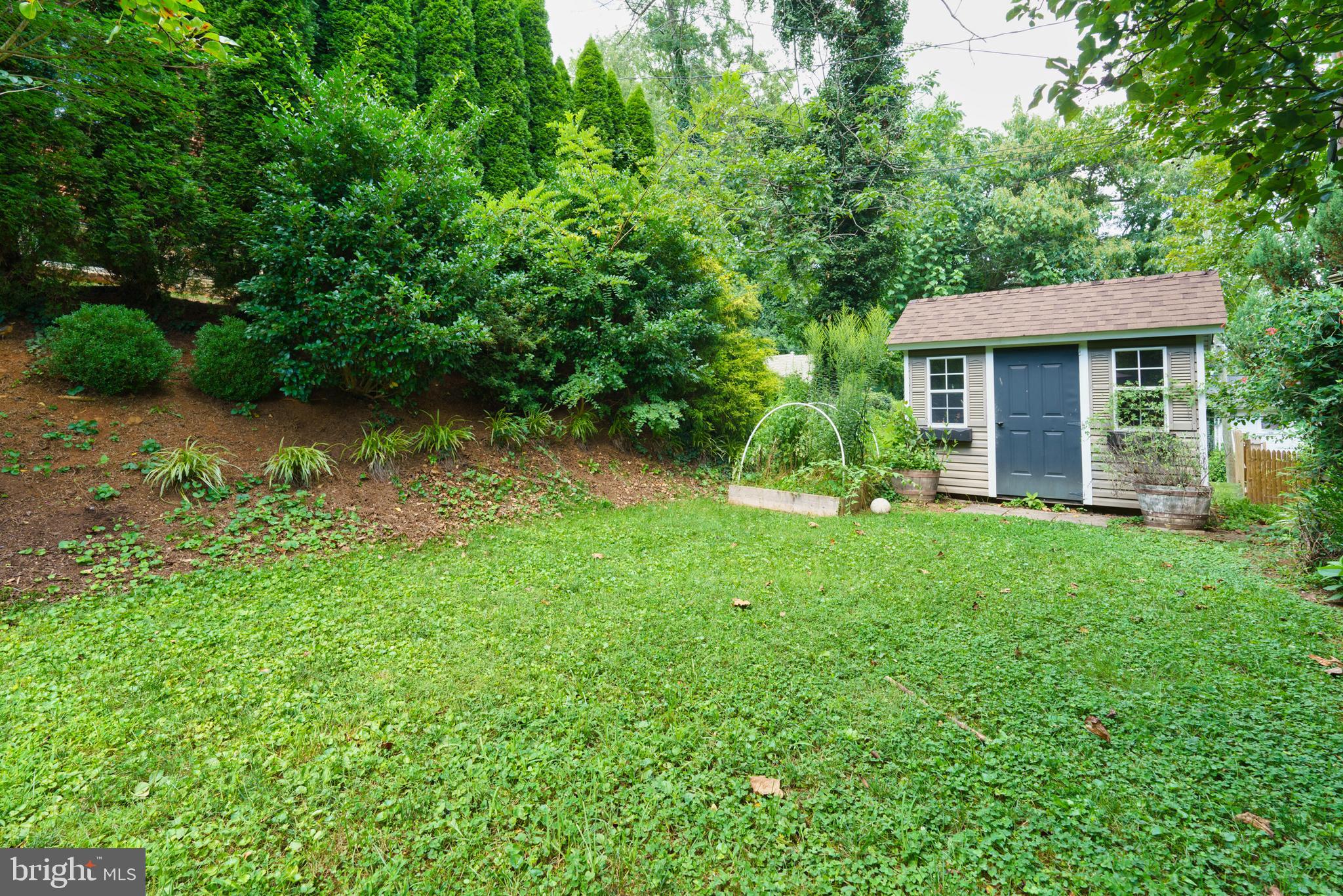 5708 Rockspring Road, Unit B Baltimore, MD 21209 - Photo 16 of 19 a view of a house with yard and a garden