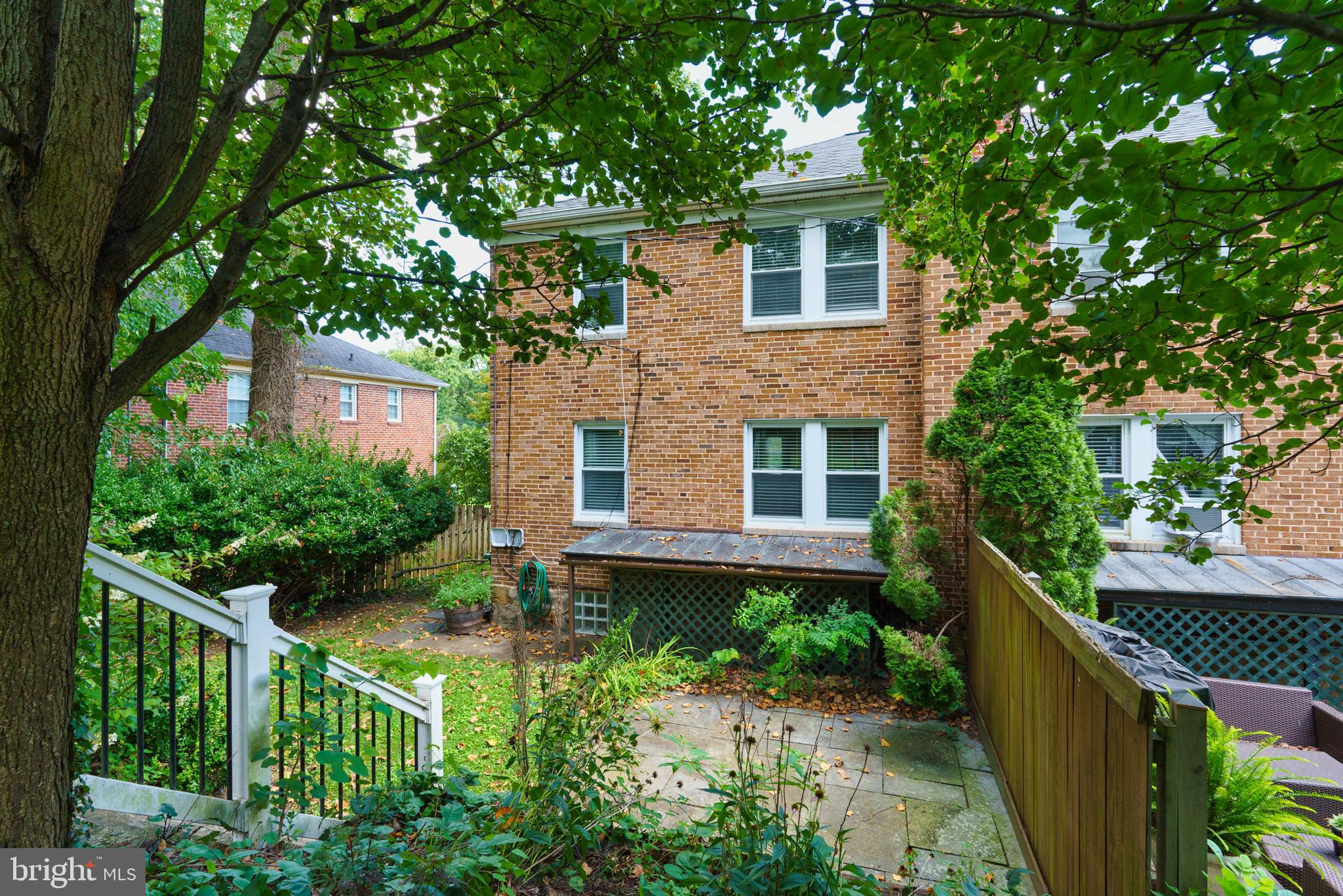 5708 Rockspring Road, Unit B Baltimore, MD 21209 - Photo 19 of 19 a front view of a house with a yard