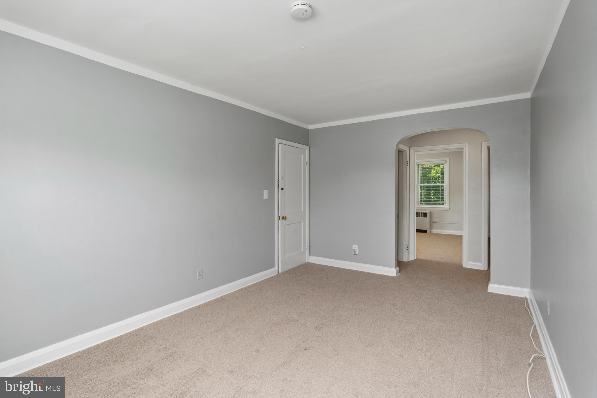 5708 Rockspring Road, Unit B Baltimore, MD 21209 - Photo 5 of 19 a view of an empty room with a window