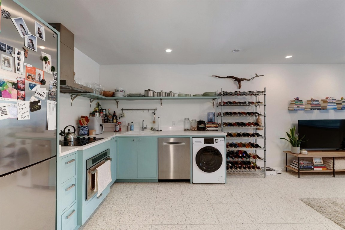 1208 Enfield Road, Unit 202 Austin, TX 78703 - Photo 11 of 19 a kitchen with a sink a stove and cabinets
