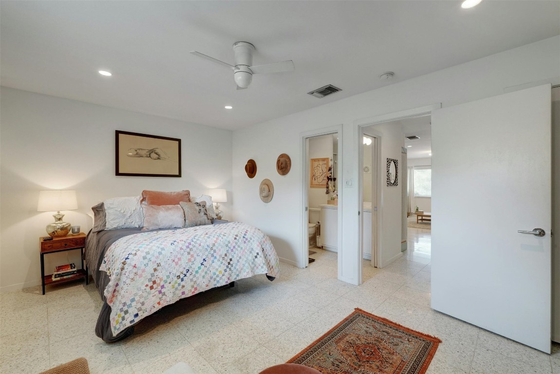 1208 Enfield Road, Unit 202 Austin, TX 78703 - Photo 13 of 19 a spacious bedroom with a bed and a view of bathroom